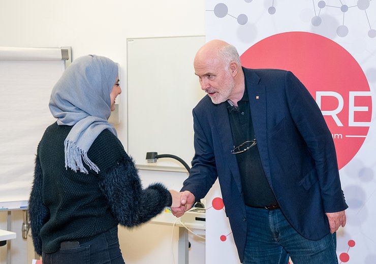 Welcome TU.code graduation 2019, Dean Hannes Werthner congratulates a graduate of the course