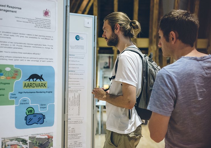 Guests explore the poster exhibition. — Picture: Amélie Chapalain / TU Wien Informatics