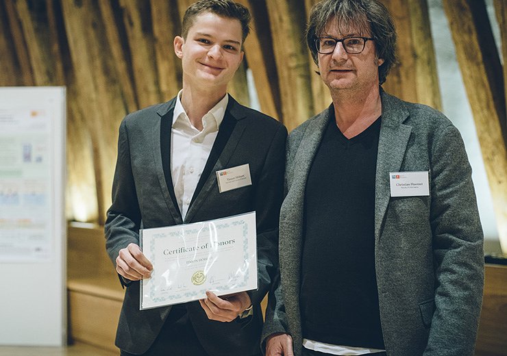 Timon and Dean of Studies, Christian Huemer, at the 28th Epilog receiving his certificate.