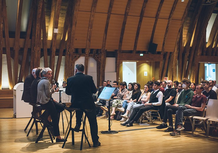 Panelists Christiane Wendehorst, Marc Rotenberg, and Hannes Werthner discussed AI regulations.