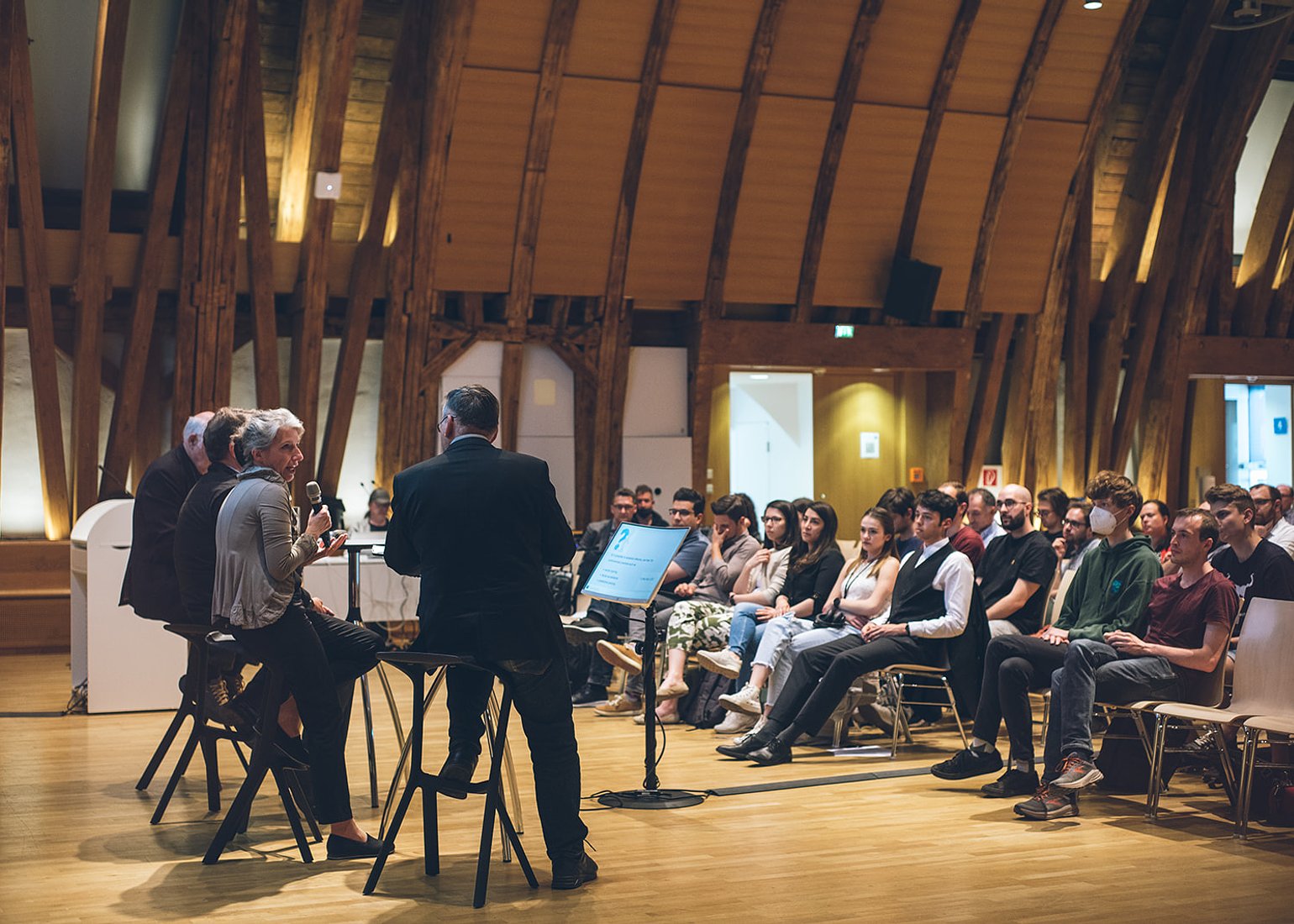 Panelists Christiane Wendehorst, Marc Rotenberg, and Hannes Werthner discussed AI regulations.