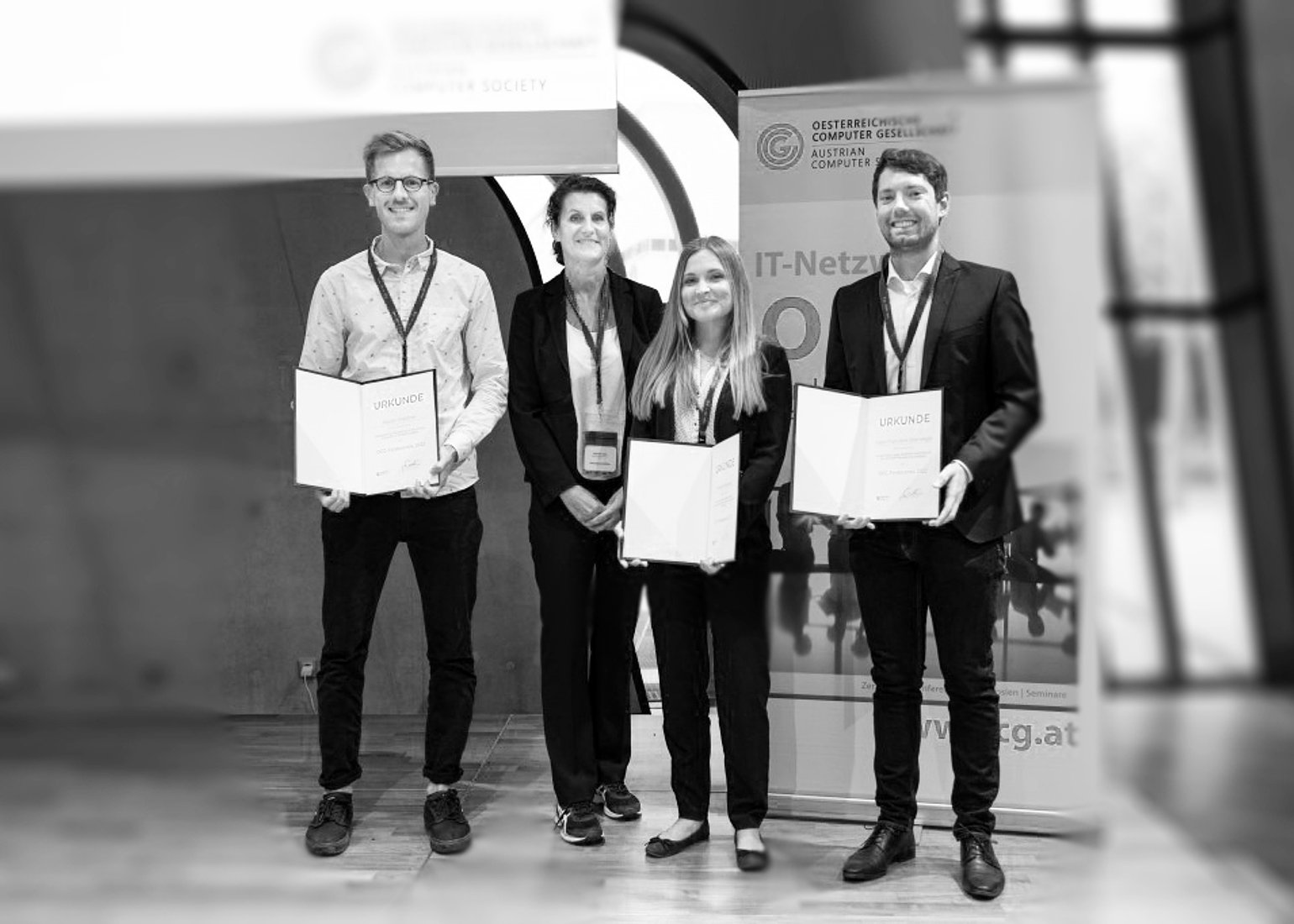 Martin Plattner, Gabriele Kotsis, Theresa Neubauer and Fabio Oberweger at the award ceremony (fltr).