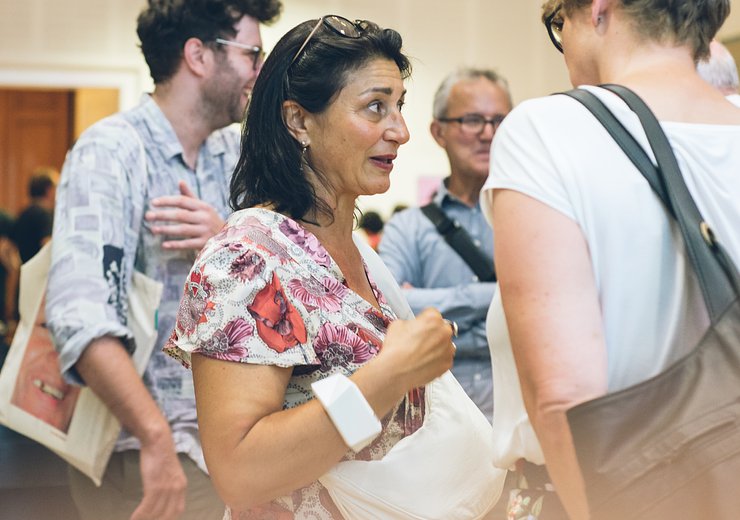 Veronica Kaup-Hasler talking to attendees after the event — Picture: Amélie Chapalain / TU Wien Informatics